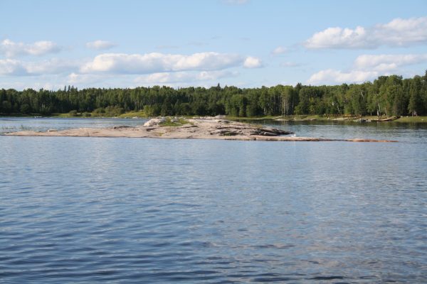 Visible island on the Winnipeg River during low water levels.